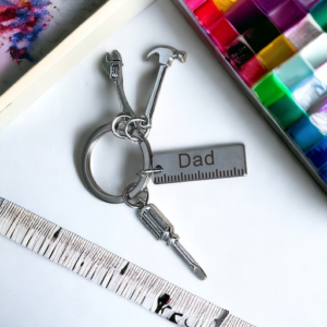 keyring with tool charms and dad token