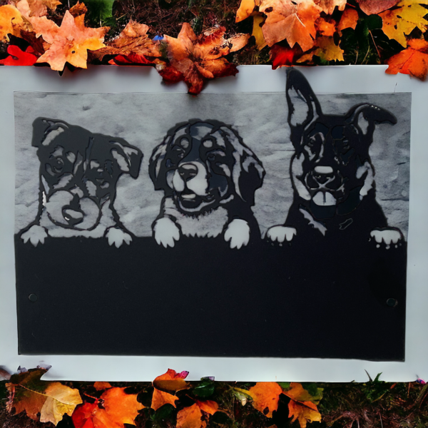 Black metal house name plaque with a picture of 3 dogs