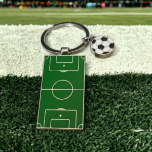 A keyring with a representation of a football pitch and a football charm