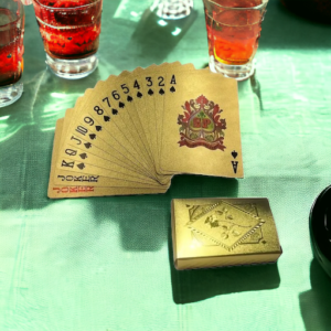 A deck of golden playing cards on a green background