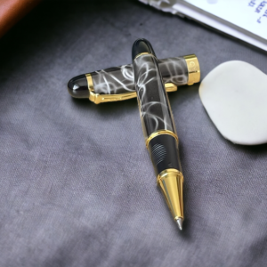 Grey marble rollerball pen on a grey fabric background