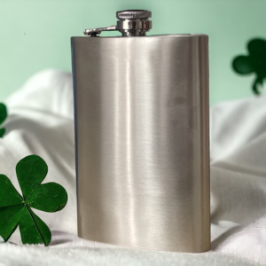 stainless steel hip flask with a green background