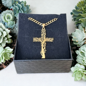 gold cross necklace in the shape of tree of life