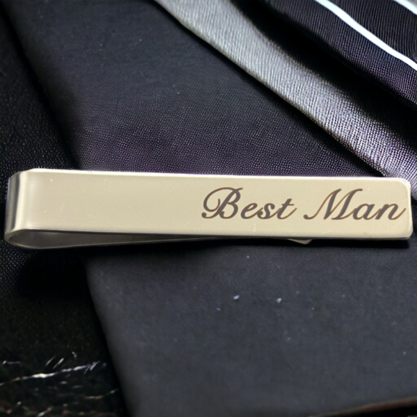 tie clip on a black background reading 'Best Man'