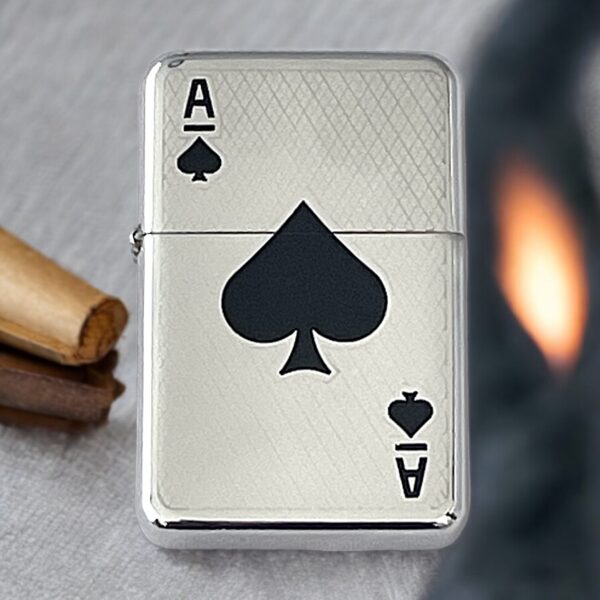 Silver coloured fuel lighter with ace of spades emblem