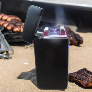 Arc lighter with barbecue in the background