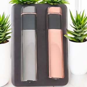 Black and rose gold slim arc lighter with plants in the background